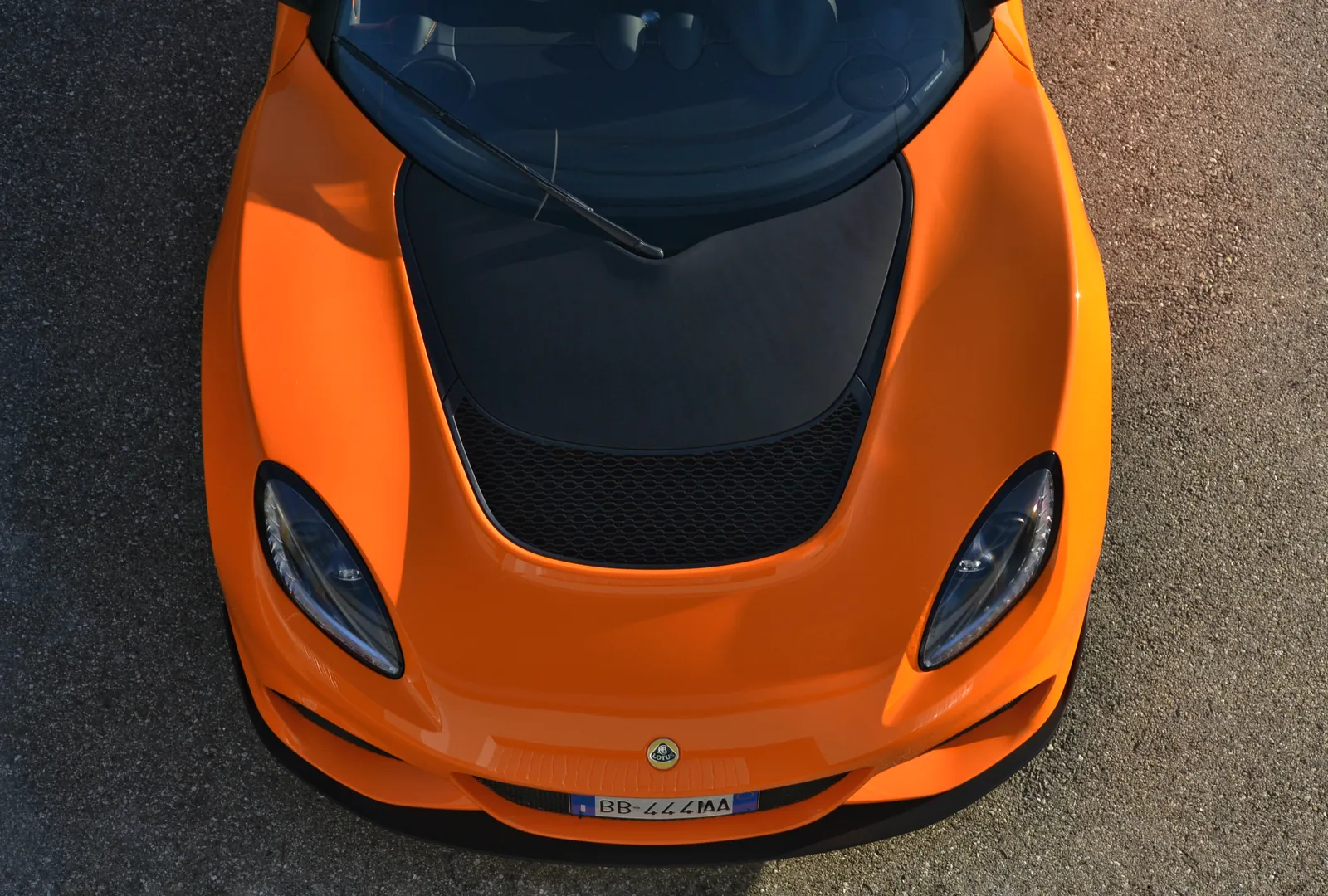 Orange Lotus sports car seen from above